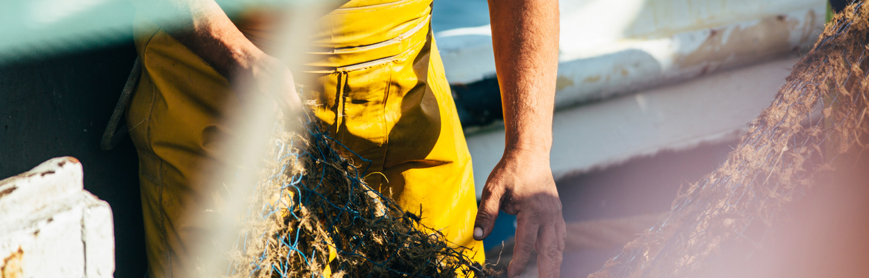 man and fishing net