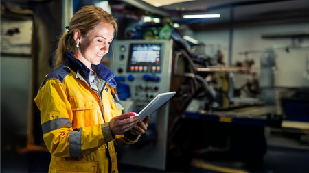 Female crew using a pad in engine room