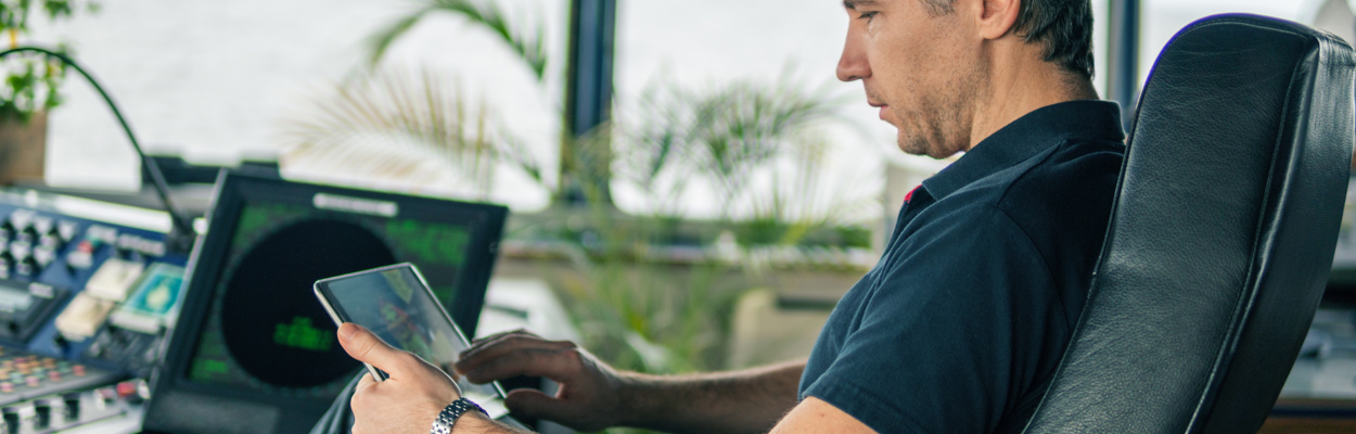 adobestock 252974680 male on bridge and device