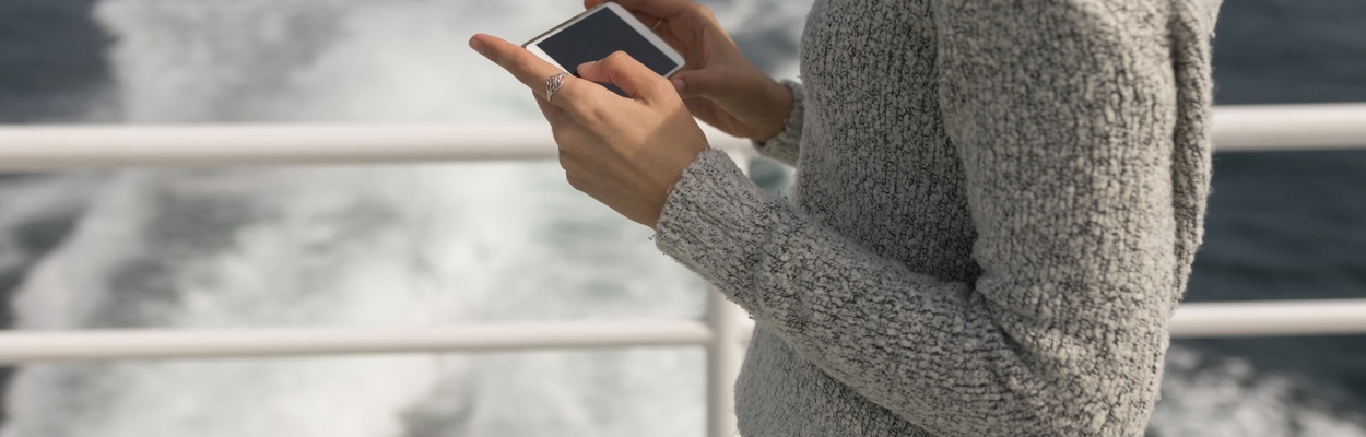 adobestock 213030122 ferry, girl's torso and mobile